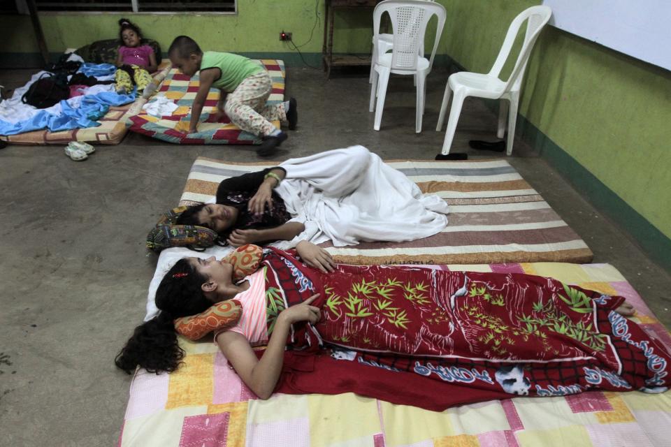 People rest inside an evacuation center in Managua after an earthquake shook Nicaragua October 13, 2014. (REUTERS/Oswaldo Rivas)