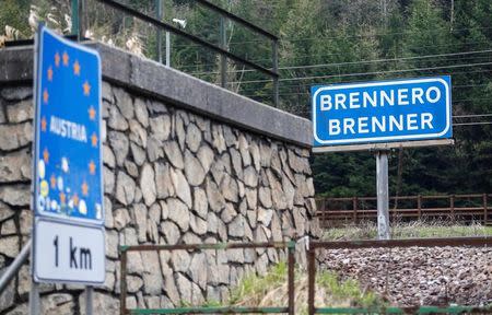 FILE PHOTO: A street sign reading "Austria" and "Brenner - Brennero" is pictured in the Italian village of Brenner on the Italian-Austrian border, Italy, May 3, 2016. REUTERS/ Dominic Ebenbichler