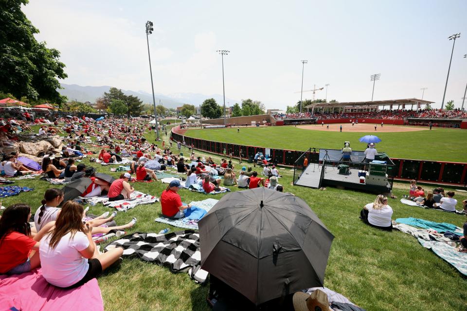 Fans watch from the outfield as the University of Utah softball team plays Ole Miss in NCAA Regional in Salt Lake City. 