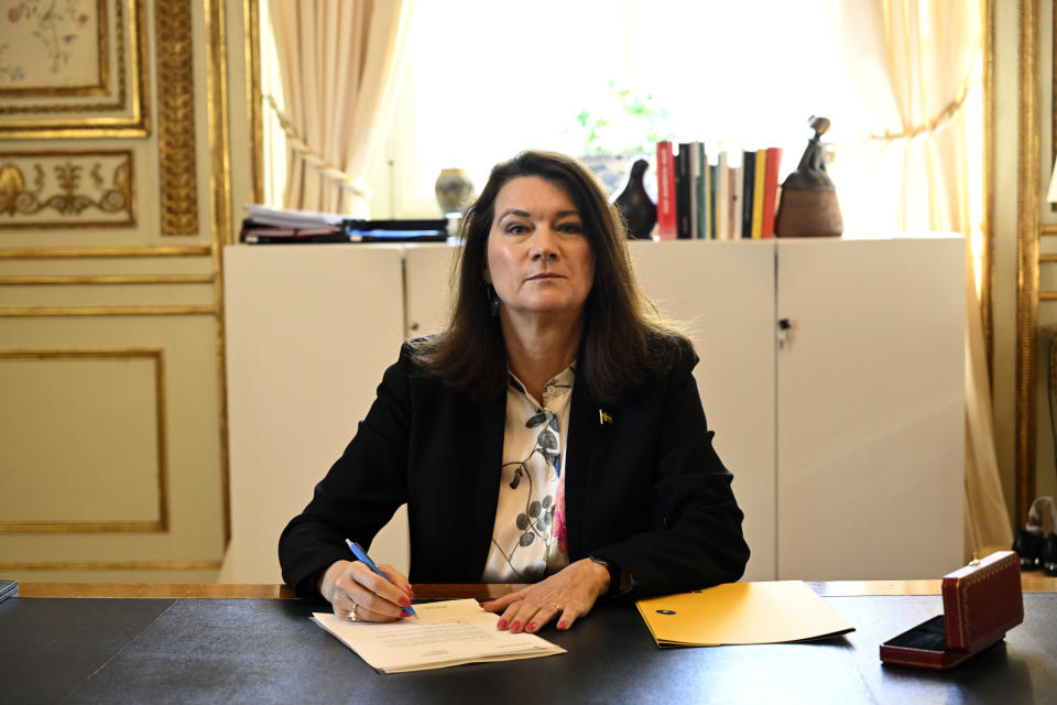 Swedish Minister of Foreígn Affairs Ann Linde poses for photographers as she signs Sweden's application for NATO membership at the Ministry of Foreign Affairs, in Stockholm, Tuesday, May 17 2022. Sweden's decision to seek NATO membership follows a similar decision by neighboring Finland, a historic shift for the countries, which have been nonaligned for generations. (Henrik Montgomery/TT News Agency via AP)