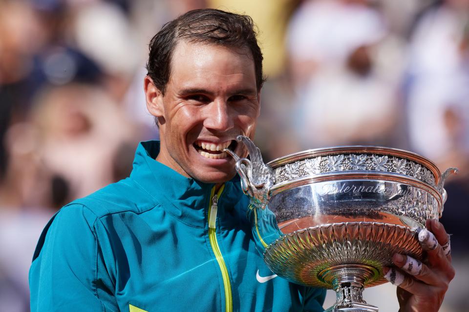 This file photo taken on June 5, 2022 shows Rafael Nadal of Spain with his trophy during the award ceremony after the men's singles final match between Rafael Nadal of Spain and Kasper Ruud of Norway at the French Open tennis tournament in Roland Garros Is.  in Paris, France.  On 5 June, Spain's Rafael Nadal defeated Norway's Kasper Ruud in straight sets to win his 14th French Open championship, becoming the first player in the Open Era to win 22 men's Grand Slam titles.  (Photo Meng Dingbo/Xinhua via Getty Images)