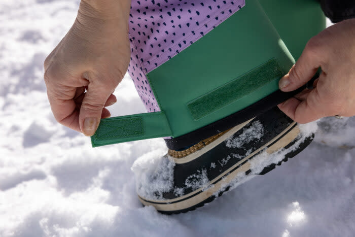 Testing the adjustable cuffs on the <strong><a href="https://us.namuk.com/products/crusade-snow-pants-purple-blue?ctc=gjbgapparelsnowkidsgear" rel="nofollow noopener" target="_blank" data-ylk="slk:Namuk Crusade Snow Pants Upcycled;elm:context_link;itc:0;sec:content-canvas" class="link ">Namuk Crusade Snow Pants Upcycled</a></strong>; (photo/Will Rochfort)