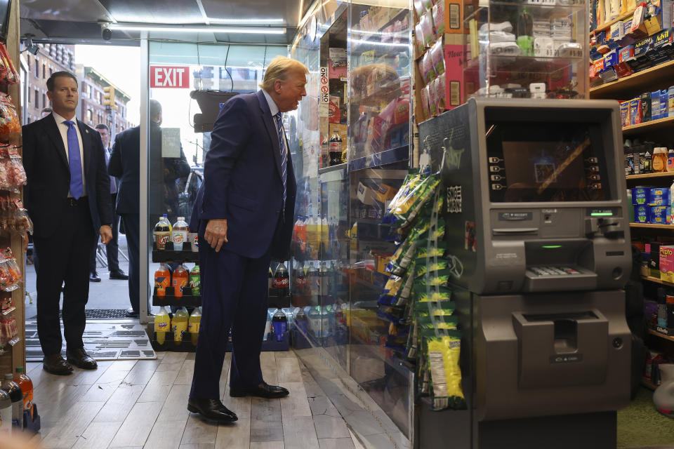 Former President Donald Trump talks with bodega owner Maad Ahmed during a visit to his store, Tuesday, April 16, 2024, in New York. Fresh from a Manhattan courtroom, Donald Trump visited a New York bodega where a man was stabbed to death, a stark pivot for the former president as he juggles being a criminal defendant and the Republican challenger intent on blaming President Joe Biden for crime. (AP Photo/Yuki Iwamura)