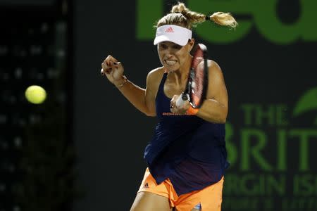 Mar 29, 2017; Miami, FL, USA; Angelique Kerber of Germany hits a forehand against Venus Williams of the United States (not pictured) on day nine of the 2017 Miami Open at Crandon Park Tennis Center. Williams won 7-5, 6-3. Mandatory Credit: Geoff Burke-USA TODAY Sports