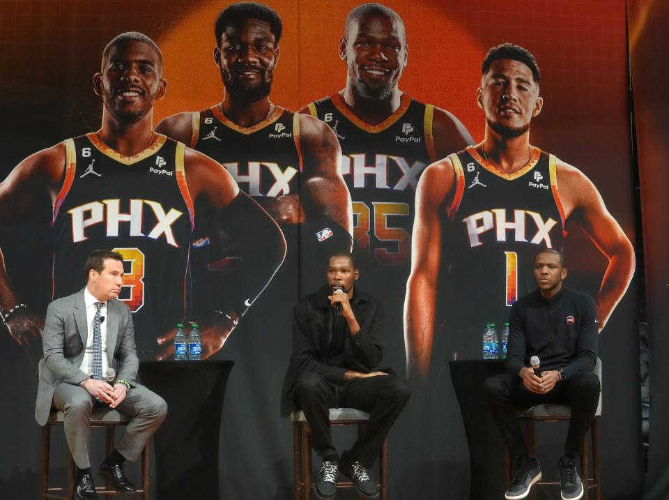 Kevin Durant is introduced as a member of the Phoenix Suns standing next to team owner  Mat Ishbia and general manager James Jones during a news conference at Footprint Center in Phoenix on Feb. 16, 2023.