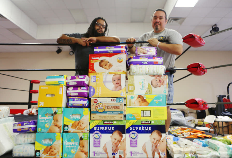 Colony Soto, right, set up his training center as an impromptu supply shelter, and helped get food and supplies to a domestic violence shelter in need. (Photo: Andy Campbell/HuffPost)