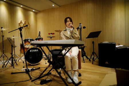 Japanese Miyu Takeuchi, a trainee with the K-pop agency Mystic Entertainment, sings during a training session in Seoul, South Korea, March 22, 2019. REUTERS/Kim Hong-Ji