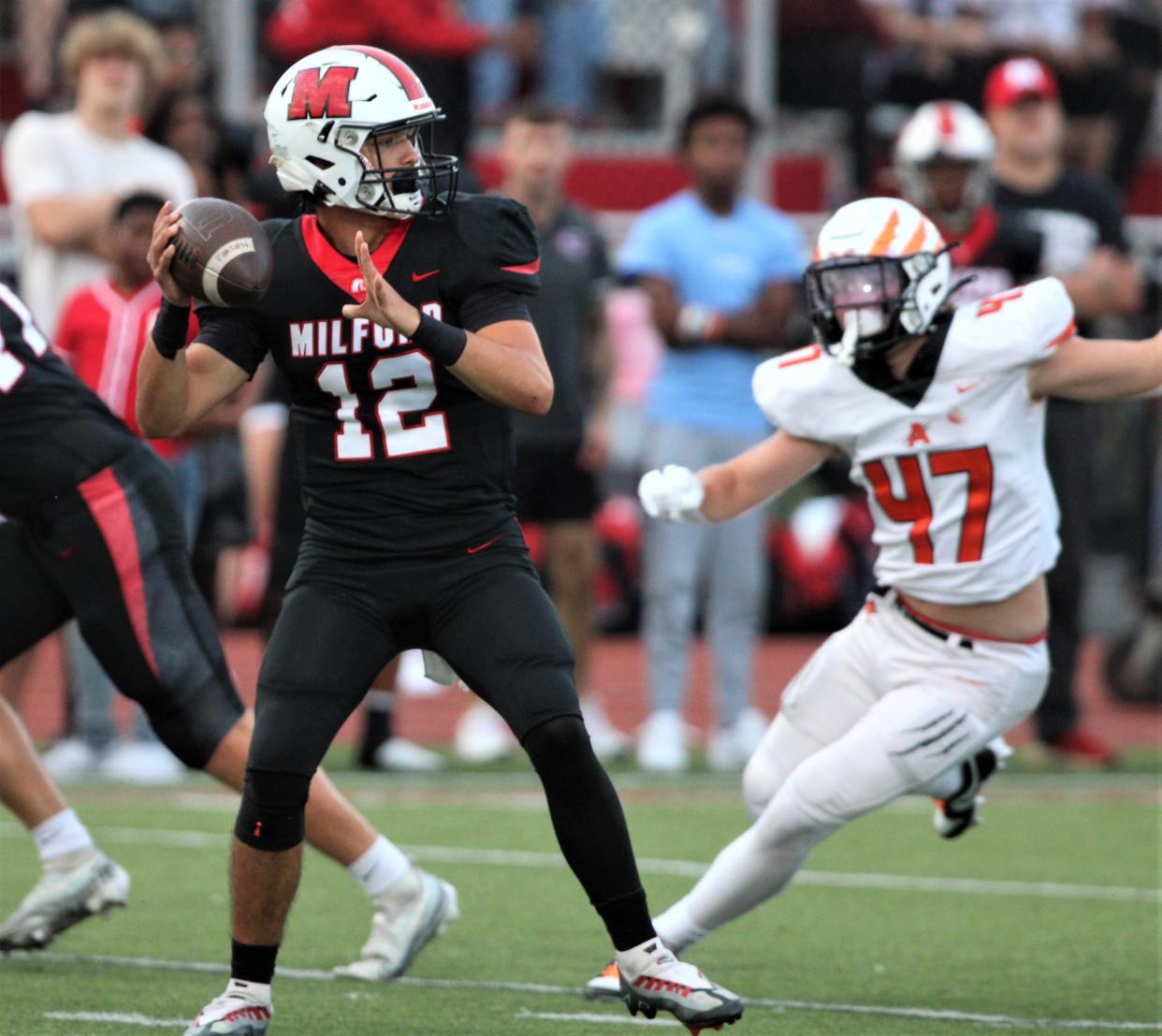 QB Luke Brand led Milford to the ECC title.