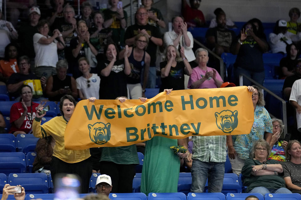 FILE - Fans hold up a sign after Brittney Griner was introduced in the Phoenix Mercury starting lineup for a WNBA basketball game against the Dallas Wings, June 7, 2023, in Arlington, Texas. Griner’s return to the WNBA after nearly 10 months in a Russian prison hasn’t always been the smoothest ride. There have been injuries. There was a break for mental health. But there have also been many moments of joy. She was welcomed by adoring crowds at nearly every WNBA arena. Individually, she played well, and was selected to play in another All-Star game. (AP Photo/Tony Gutierrez, File)