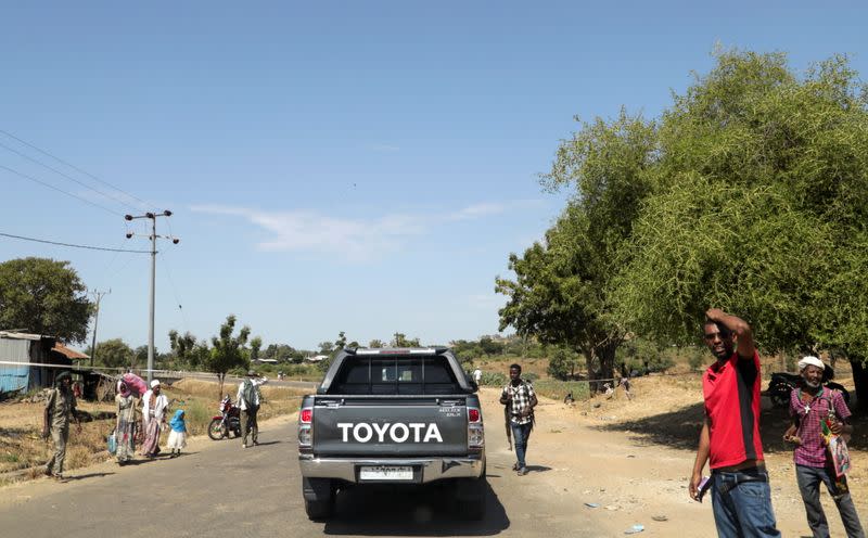Members of Amhara militia control a motor vehicle checkpoint at the entrance of Dansha town in Tigray Region