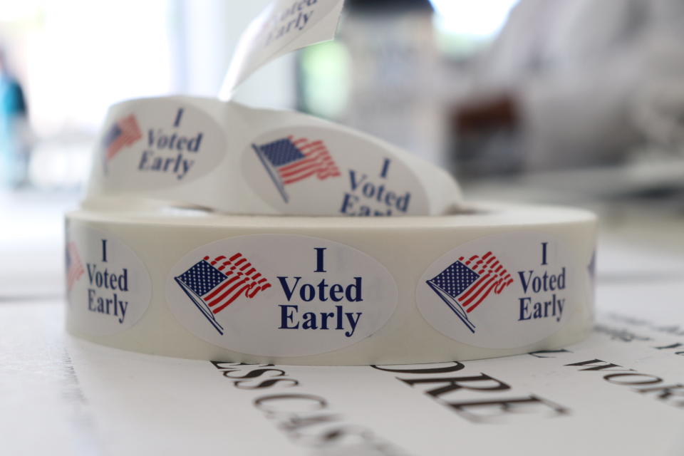 FILE - A roll of stickers awaiting distribution to early voters sits on a table at the check-in station at the Pulaski County Courthouse Annex in Little Rock, Ark., on Monday, May 21, 2018. On Friday, Sept. 8, 2023, The Associated Press reported on stories circulating online incorrectly claiming Arkansas is switching to election ballots that are marked by hand rather than by machine. (AP Photo/Kelly P. Kissel)