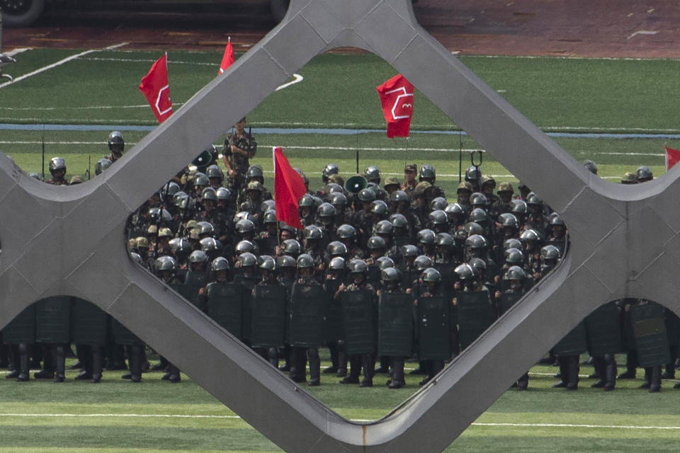 Chinese paramilitary policemen go through drills at the Shenzhen Bay Stadium in Shenzhen in Southern China's Guangdong province on Sunday, Aug. 18, 2019. A spokesman for China's ceremonial legislature has condemned statements from U.S. lawmakers supportive of Hong Kong's pro-democracy movement. (AP Photo/Ng Han Guan)