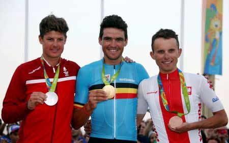 2016 Rio Olympics - Cycling Road - Victory Ceremony - Men's Road Race Victory Ceremony - Fort Copacabana - Rio de Janeiro, Brazil - 06/08/2016. Jakob Fuglsang (DEN) of Denmark, Greg Van Avermaet (BEL) of Belgium and Rafal Majka (POL) of Poland pose with their medals. REUTERS/Eric Gaillard