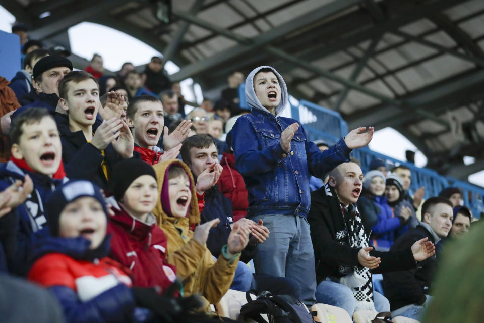 Young fans react during a Belarus soccer match on March 27. Longtime Belarus President Alexander Lukashenko is proudly keeping soccer and hockey arenas open even though most sports around the world have shut down because of the coronavirus pandemic. (Sergei Grits / AP)