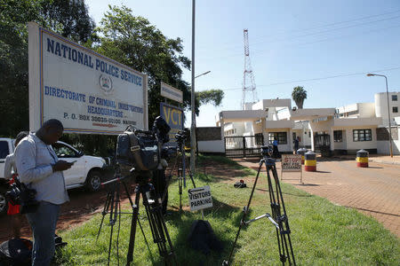 Journalists wait outside the Director of Criminal Investigation headquarters, following the arrest of the head of the National Youth Service Richard Ndubai along with an unspecified number of officials over corruption in Nairobi, Kenya May 28, 2018. REUTERS/Baz Ratner