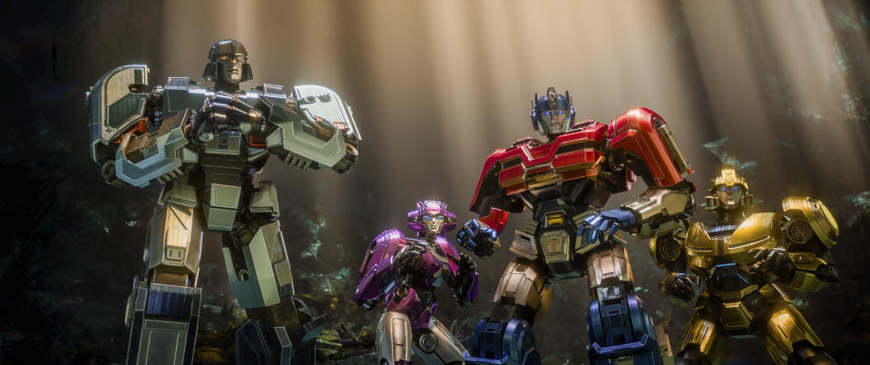 This image released by Paramount Pictures shows characters, from left, D-16/Megatron, voiced by Brian Tyree Henry, Elita-1, voiced by Scarlett Johansson, Orion Pax/Optimus Prime, voiced by Chris Hemsworth, and B-127, voiced by Keegan-Michael Key, in a scene from "Transformers One." (Paramount Pictures via AP)