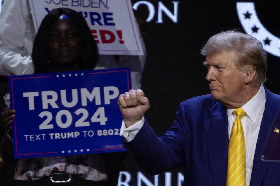 Republican presidential candidate and former U.S. President Donald Trump gestures during a Turning Point USA event at the Dream City Church in Phoenix, Arizona on June 6, 2024.