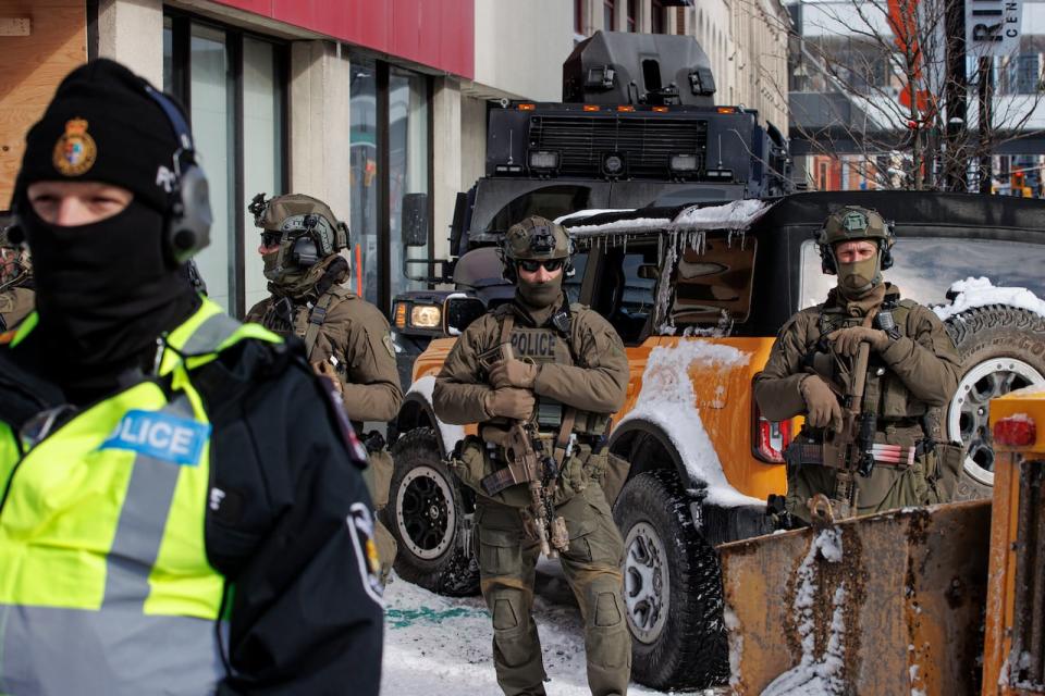 Police from across the country enforce an injunction against protesters camped in downtown Ottawa on Feb. 18, 2022.