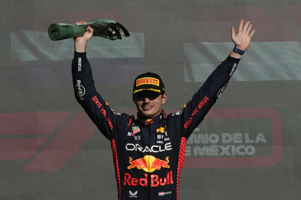 Red Bull driver Max Verstappen of the Netherlands celebrates on the podium after winning the Formula One Mexico Grand Prix auto race at the Hermanos Rodriguez racetrack in Mexico City, Sunday, Oct. 29, 2023. (AP Photo/Fernando Llano)