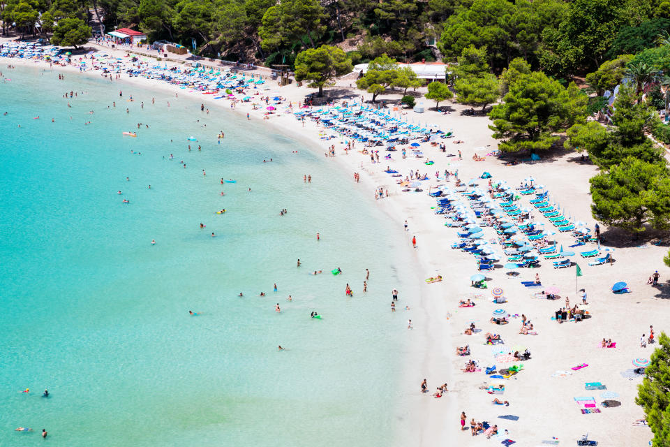 Cala Galdana is a coastal resort in Menorca, with a popular horseshoe shaped beach. (Getty Images)