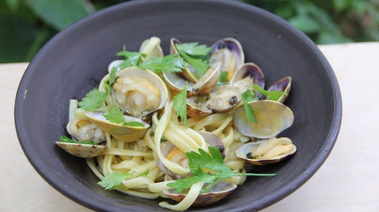 pasta with clams in ceramic bowl