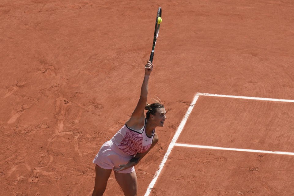 Aryna Sabalenka of Belarus serves against Ukraine's Marta Kostyuk during their first round match of the French Open tennis tournament at the Roland Garros stadium in Paris, Sunday, May 28, 2023. (AP Photo/Christophe Ena)