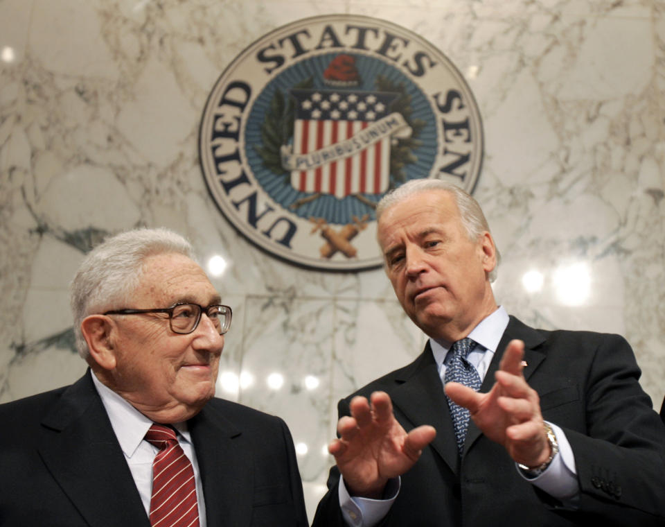 FILE - Former Secretary of State Henry Kissinger, left, talks with Senate Foreign Relations Committee Chairman Sen. Joseph Biden, D-Del., on Capitol Hill in Washington, Jan. 31, 2007, prior to Kissinger testifying before the committee about Iraq. Kissinger, the diplomat with the thick glasses and gravelly voice who dominated foreign policy as the United States extricated itself from Vietnam and broke down barriers with China, died Wednesday, Nov. 29, 2023. He was 100. (AP Photo/Susan Walsh, File)