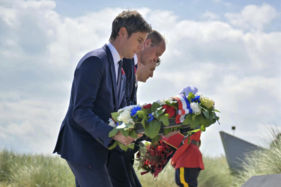 France's Prime Minister Gabriel Attal, left, Britain's Prince William, the Prince of Wales, center, and Canadian Prime Minister Justin Trudeau lay flowers during the Canadian commemorative ceremony marking the 80th anniversary of the World War II D-Day landing, at the Juno Beach Centre near Courseulles-sur-Mer, Normandy, Thursday, June 6, 2024. Normandy is hosting various events to officially commemorate the 80th anniversary of the D-Day landings that took place on June 6, 1944. (Lou Benoist, Pool via AP)