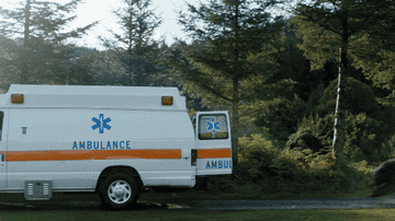 the bear jumping into the back of an ambulance in cocaine bear