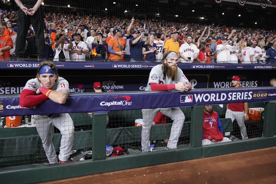 The Philadelphia Phillies watch the Houston Astros celebrate their 4-1 World Series win against the Philadelphia Phillies in Game 6 on Saturday, Nov. 5, 2022, in Houston. (AP Photo/Tony Gutierrez)