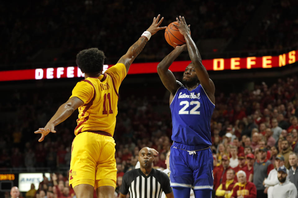 Seton Hall guard Myles Cale, right, shoots over Iowa State guard Prentiss Nixon, left, during the first half of an NCAA college basketball game, Sunday, Dec. 8, 2019, in Ames, Iowa. (AP Photo/Matthew Putney)