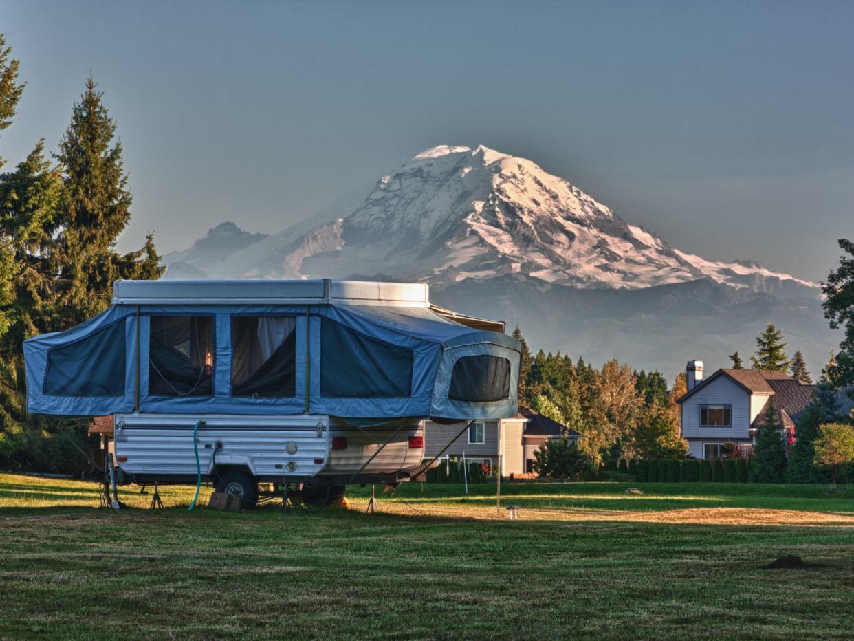 Tent Camper In a Neighborhood Back Yard with Mount Rainier in the background.