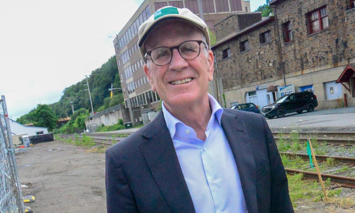 <span>Peter Welch, a Vermont senator, stands where the new Amtrak station will be built in Brattleboro, Vermont.</span><span>Photograph: Kristopher Radder/AP</span>