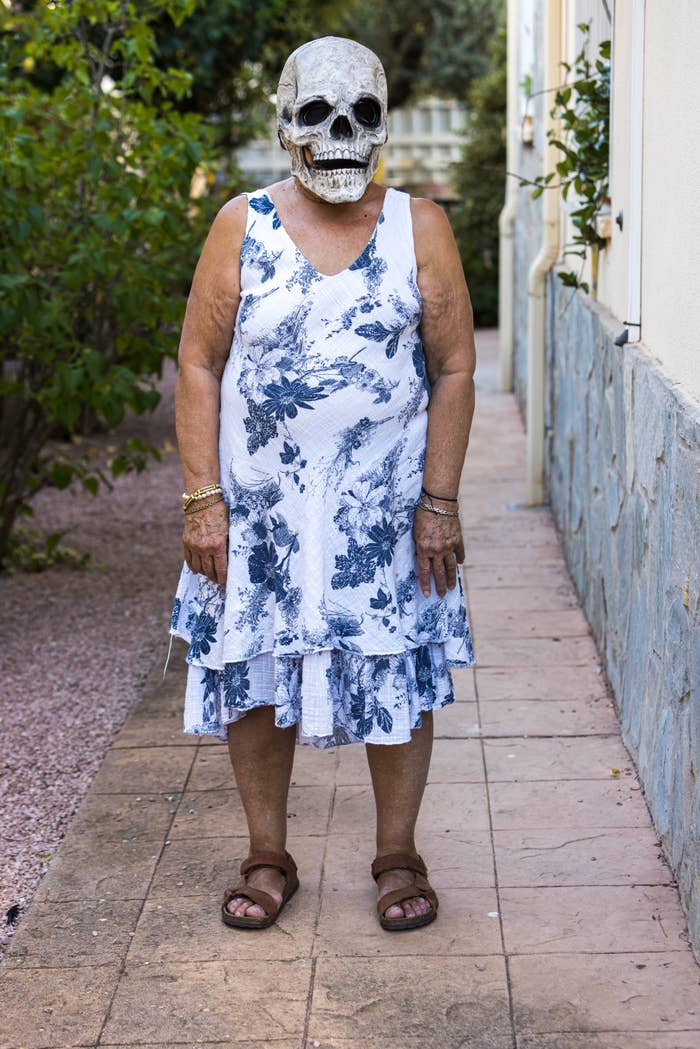 A person wearing a skull mask