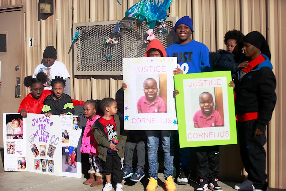 Cornelius Carrington's cousins gathered at Rise Academy where they held signs to bring more attention to the 4-year-old's death from a Dec. 17, 2021 drive by shooting.