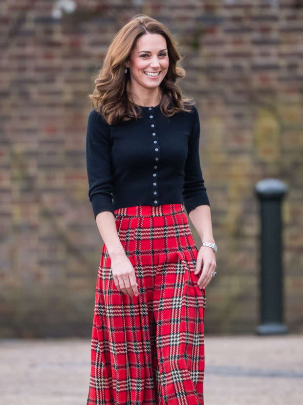 <p>Kate Middleton keeps the chic factor dialed to "festive" in a red tartan skirt at a December 2018 party thrown for families of military personnel who were deployed in Cyprus.</p>