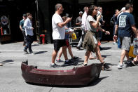 <p>A bumper from a vehicle that struck pedestrians and later crashed in Times Square is seen on the sidewalk in New York City on May 18, 2017. (Mike Segar/Reuters) </p>