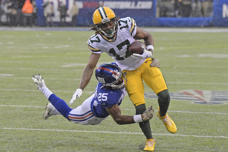 New York Giants' Corey Ballentine, left, tries to tackle Green Bay Packers' Davante Adams during the first half of an NFL football game, Sunday, Dec. 1, 2019, in East Rutherford, N.J. (AP Photo/Bill Kostroun)