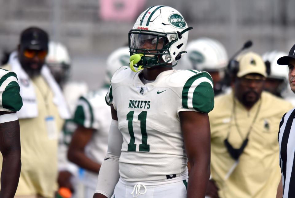 Rueben Bain (11) of Miami Central waits on the sideline  before the Class 5A state championship game against Merritt Island at DRV PNK Stadium, Fort Lauderdale, FL  Dec. 17, 2021. 