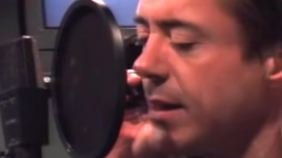 Robert Downey Jr. singing into a microphone