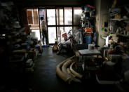 A man is seen near ivories for making 'hanko' or carved name seals at his factory in Tokyo, Japan November 28, 2016. Picture taken November 28, 2016. REUTERS/Issei Kato