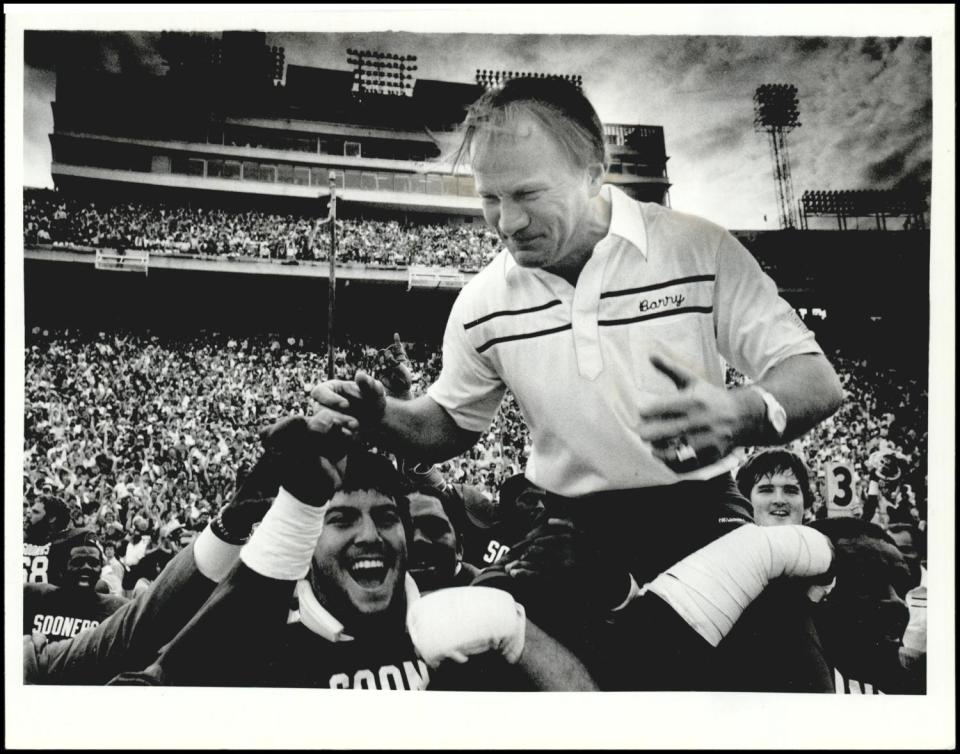 OU coach Barry Switzer gets a victory ride in front of the jam-packed Cotton Bowl in Dallas after the Sooners beat Texas 28-22 on Oct. 10, 1982.