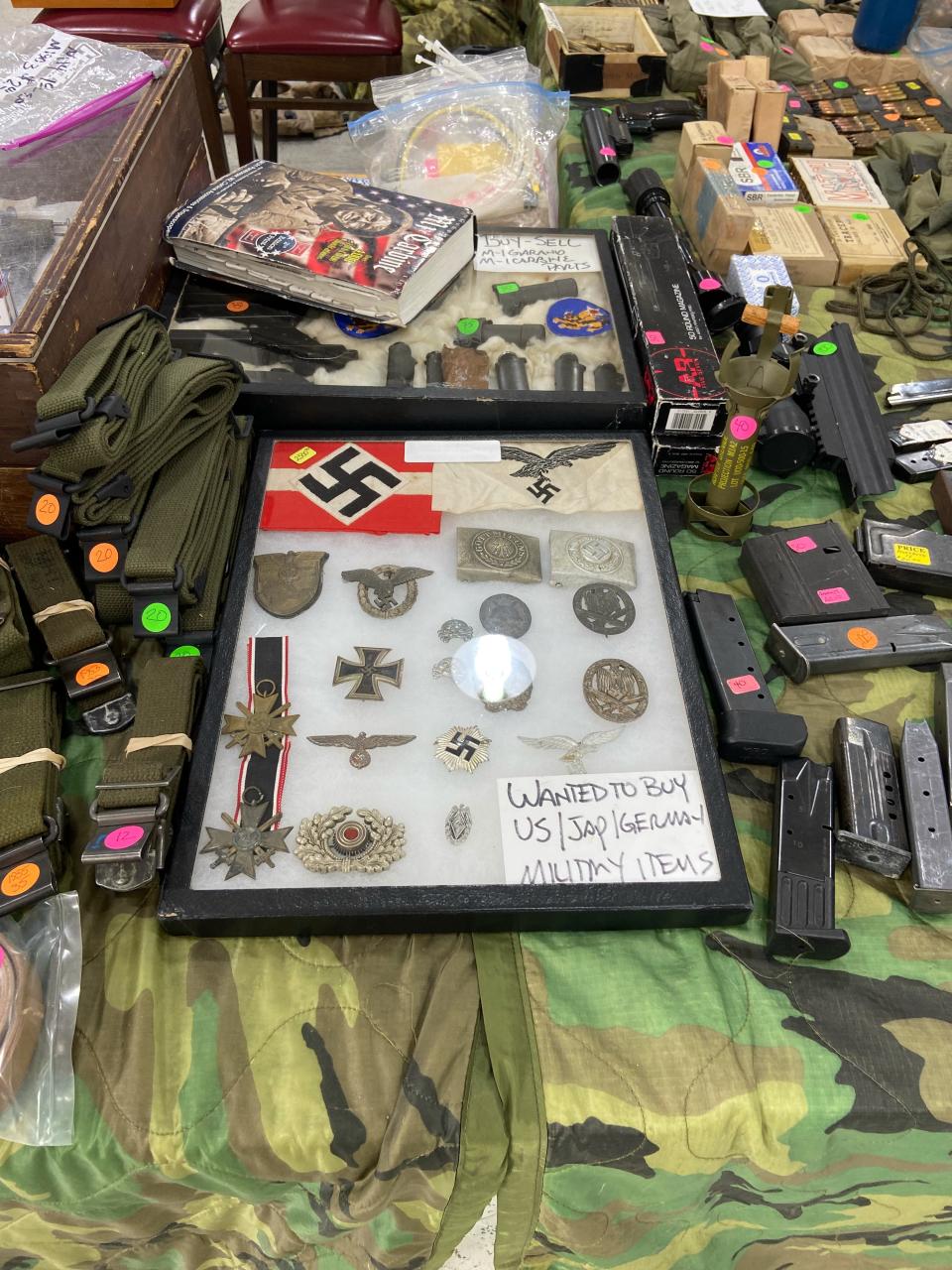 A stand at the Atlanta Gun Show displays Nazi memorabilia.