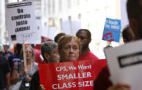 Chicago Teachers Union members picket prior to a Chicago Board of Education meeting on Wednesday, Aug. 22, 2012 in Chicago. The union called for fair contracts with higher pay for its teachers. (AP Photo/Sitthixay Ditthavong)