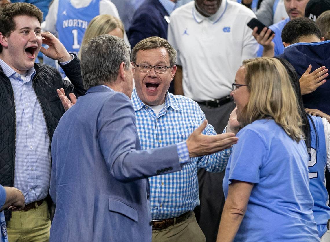 North Carolina Governor Roy Cooper and House Speaker Tim Moore relish in North Carolina’s 81-77 victory over Duke in the NCAA Final Four semi-final on Saturday, April 2, 2022 at Caesars Superdome in New Orleans, La.
