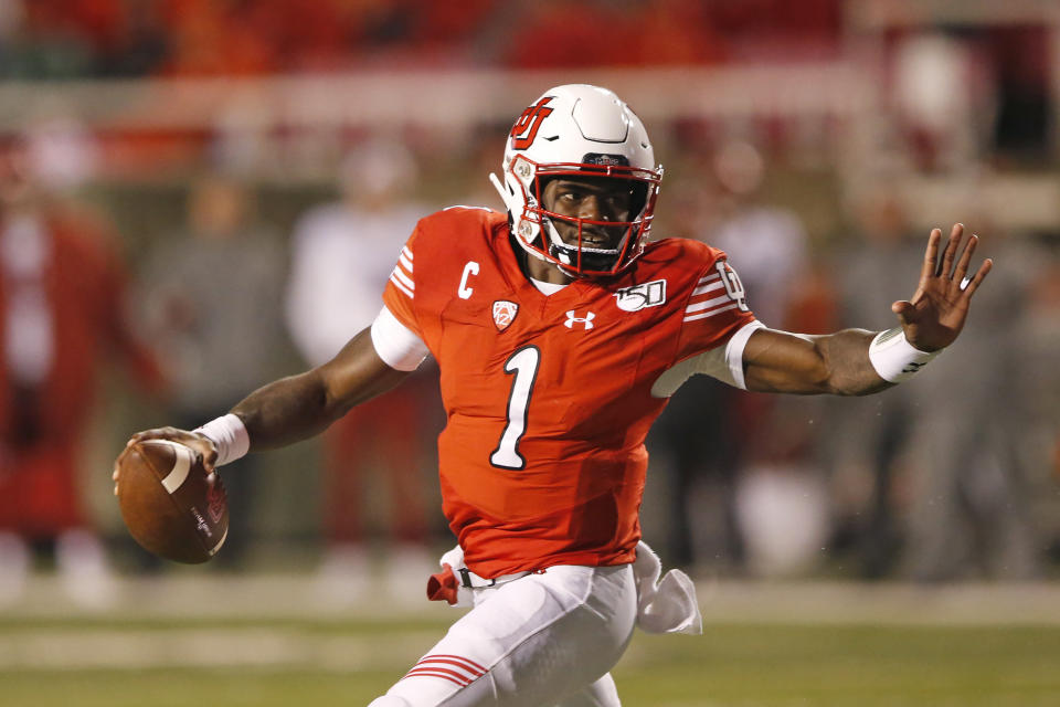 Utah quarterback Tyler Huntley (1) carries the ball in the second half of an NCAA college football game against Washington State Saturday, Sept. 28, 2019, in Salt Lake City. (AP Photo/Rick Bowmer)