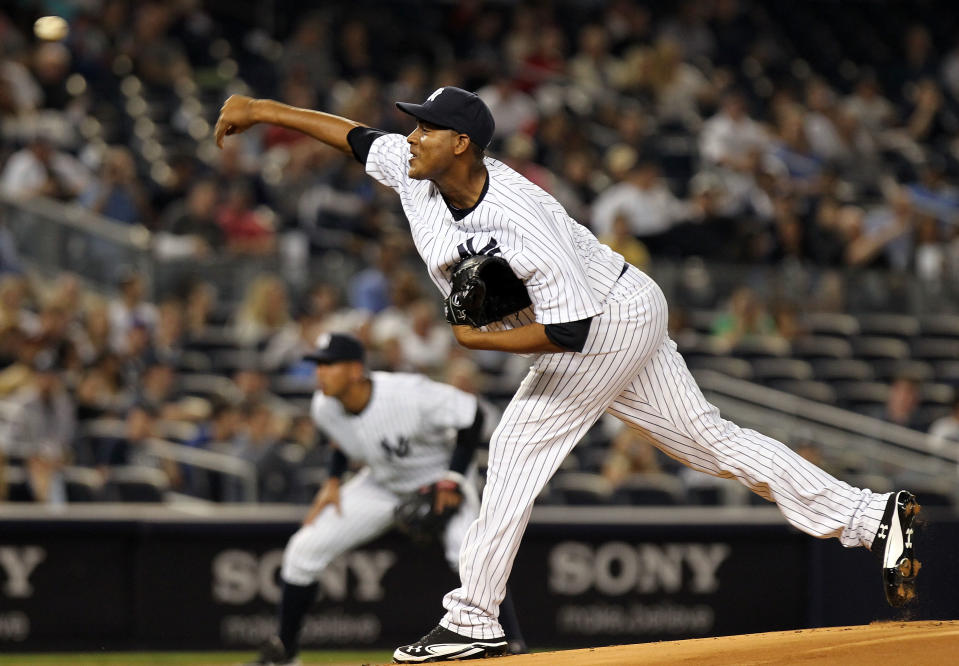NEW YORK, NY - APRIL 15: Ivan Nova of the New York Yankees pitches against the Los Angeles Angels of Anaheim at Yankee Stadium on April 15, 2012 in the Bronx borough of New York City. In honor of Jackie Robinson Day, all players across Major League Baseball will wear number 42(Photo by Nick Laham/Getty Images)