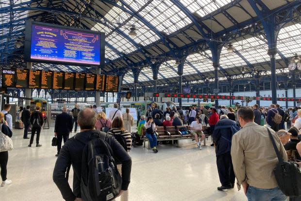 Commuters, like these at Brighton Station this morning, face another day of disruption amid continuing industrial action