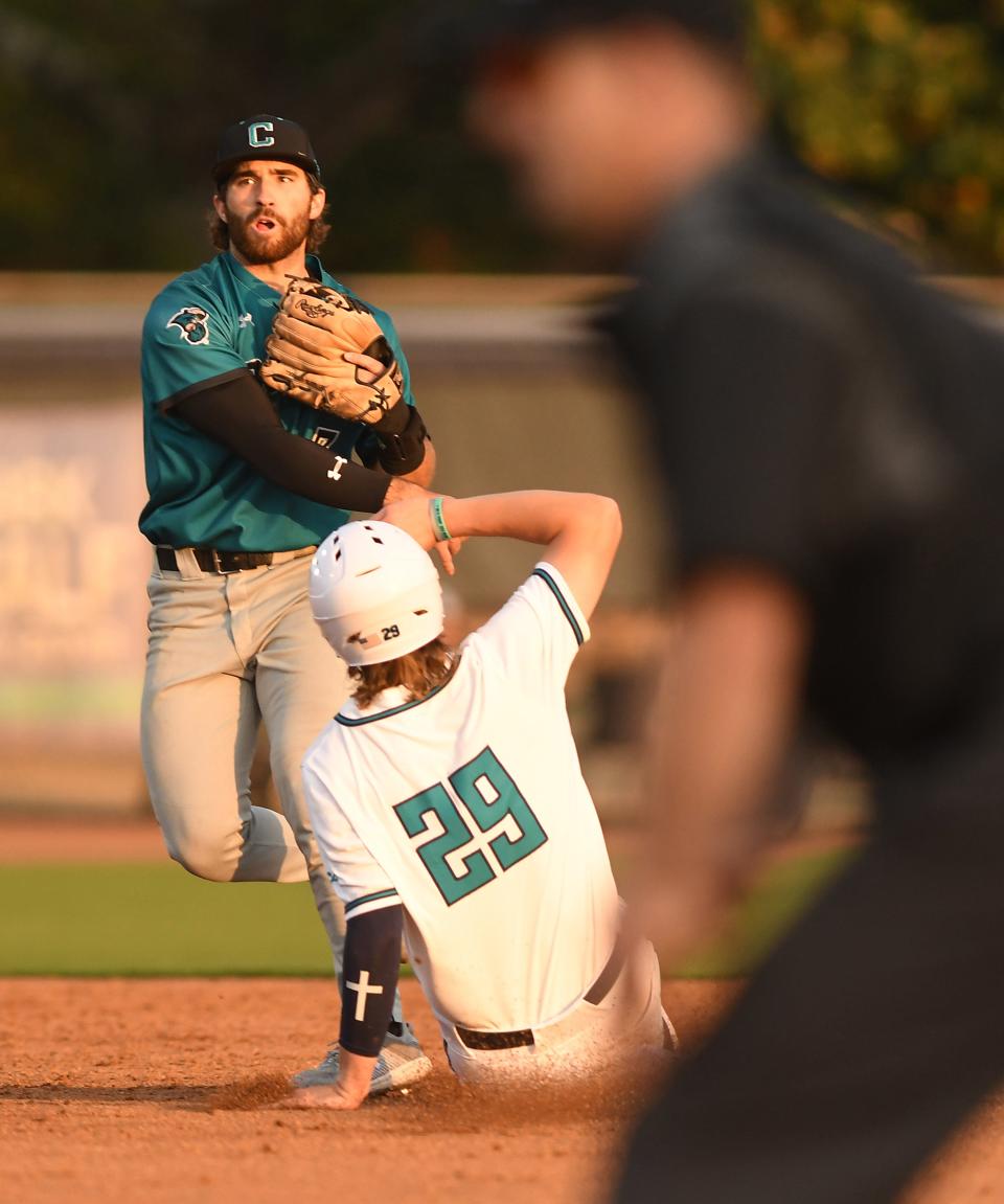 UNCW's #29 Tanner Thach is out at 2nd base as Coastal's #7 Blake Barthol makes the double play as UNCW took on Coastal Carolina Tuesday April 2, 2024 at home. UNCW won 6-4. KEN BLEVINS/STARNEWS