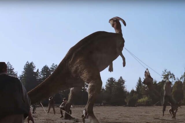 A Parasaurolophus is pulled by men with ropes in the  Jurassic Park film series.